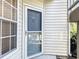 Gray front door with glass panel and a simple design at 850 S Tamiami Trl # 402, Sarasota, FL 34236