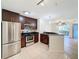 Modern kitchen with stainless steel appliances and granite counters at 850 S Tamiami Trl # 402, Sarasota, FL 34236