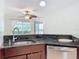 Kitchen features granite countertops and stainless steel sink at 850 S Tamiami Trl # 402, Sarasota, FL 34236