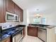 Modern kitchen with stainless steel appliances and granite countertops at 850 S Tamiami Trl # 402, Sarasota, FL 34236