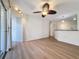 Open concept living area with wood-look floors and kitchen island at 850 S Tamiami Trl # 402, Sarasota, FL 34236