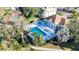 Inviting community pool and spa area with lounge chairs and landscaping at 850 S Tamiami Trl # 402, Sarasota, FL 34236