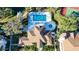 Aerial view of community pool, spa, and tennis courts at 850 S Tamiami Trl # 402, Sarasota, FL 34236