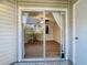 Glass sliding door leading to a screened-in patio at 850 S Tamiami Trl # 402, Sarasota, FL 34236