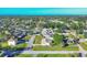 An aerial view of a quiet neighborhood featuring tree lined streets and well-maintained lawns at 865 Beverly Rd, Venice, FL 34293