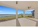 Relaxing covered patio overlooking a lake at 10124 Silent Night Ln, Sarasota, FL 34241