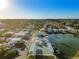 Aerial view of community with homes, lake, and recreational facilities at 1111 49Th Avenue W Dr, Bradenton, FL 34207