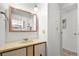 Bathroom with a vanity, sink, and mirrored medicine cabinet at 1111 49Th Avenue W Dr, Bradenton, FL 34207