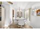 Dining room with a white table and chairs, and a chandelier at 1111 49Th Avenue W Dr, Bradenton, FL 34207