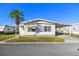 Front view of a manufactured home with a carport at 1111 49Th Avenue W Dr, Bradenton, FL 34207