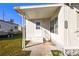 Front entrance of the manufactured home with steps and handrail at 1111 49Th Avenue W Dr, Bradenton, FL 34207