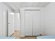 Clean hallway with light flooring and ample closet space at 1111 49Th Avenue W Dr, Bradenton, FL 34207