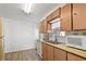 Kitchen with wood cabinets, a double sink, and a microwave at 1111 49Th Avenue W Dr, Bradenton, FL 34207
