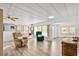 Open living area with laminate flooring and ample natural light at 1111 49Th Avenue W Dr, Bradenton, FL 34207