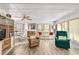 Bright living room featuring two armchairs and a sofa at 1111 49Th Avenue W Dr, Bradenton, FL 34207