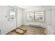 Bright living room with laminate flooring and a window offering natural light at 1111 49Th Avenue W Dr, Bradenton, FL 34207