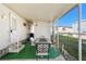 Covered patio with table and chairs, adjacent to the home at 1111 49Th Avenue W Dr, Bradenton, FL 34207