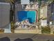 Aerial view of community pool with surrounding lounge chairs at 1111 49Th Avenue W Dr, Bradenton, FL 34207