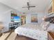 Main bedroom with ocean view and large TV at 1211 Gulf Of Mexico Dr # 408, Longboat Key, FL 34228