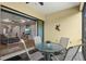 Enjoy indoor/outdoor living with this screened lanai, featuring an outdoor dining set and seamless access to the living room at 13021 Indigo Way, Bradenton, FL 34211