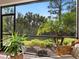 Lush backyard view from screened porch at 153 Soliera St, Nokomis, FL 34275