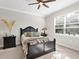 Spacious bedroom with a comfortable bed, nightstands and large windows at 153 Soliera St, Nokomis, FL 34275