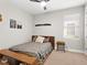 Cozy bedroom with wood bed frame and window coverings at 153 Soliera St, Nokomis, FL 34275