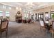 Elegant community room with stone fireplace and seating area at 153 Soliera St, Nokomis, FL 34275