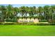 Toscana Isles entrance with lush landscaping and stonework at 153 Soliera St, Nokomis, FL 34275