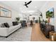Bright living room with hardwood floors, modern furniture, and open concept floor plan at 153 Soliera St, Nokomis, FL 34275