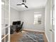 Home office with built-in desk and French doors at 153 Soliera St, Nokomis, FL 34275