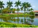 Reflecting pool, palm trees, and community building at 153 Soliera St, Nokomis, FL 34275