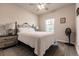 Comfortable bedroom with white bedding, ceiling fan, and nightstands at 16351 Coconut Palm Dr, Port Charlotte, FL 33953
