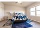 Bright and airy bedroom with blue and white bedding and large window at 16351 Coconut Palm Dr, Port Charlotte, FL 33953