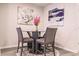 Small dining area with glass-top table and four chairs at 16351 Coconut Palm Dr, Port Charlotte, FL 33953