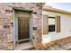 Inviting front exterior with stone accents and a covered entryway at 16351 Coconut Palm Dr, Port Charlotte, FL 33953