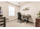 Well-lit home office with a desk, chair, and window at 16351 Coconut Palm Dr, Port Charlotte, FL 33953