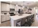 Stylish kitchen with island, stainless steel appliances, and white cabinets at 16351 Coconut Palm Dr, Port Charlotte, FL 33953