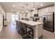 Open-concept kitchen overlooking the living room, with stainless steel appliances at 16351 Coconut Palm Dr, Port Charlotte, FL 33953
