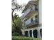 Building exterior showcasing balconies and landscaping at 1714 69Th W Ave # A207, Bradenton, FL 34207