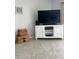Bright living room featuring a large TV and ample floor space at 1714 69Th W Ave # A207, Bradenton, FL 34207