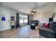 Living room with comfortable seating and a ceiling fan at 18671 Macgill Ave, Port Charlotte, FL 33948