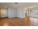 Open living room with hardwood floors, view of kitchen and entryway at 1915 43Rd W St, Bradenton, FL 34209