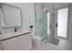 Clean bathroom with walk in shower and modern vanity at 230 W Pine Valley Ln, Rotonda West, FL 33947
