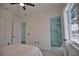 Bedroom with ensuite bathroom and pool view at 230 W Pine Valley Ln, Rotonda West, FL 33947