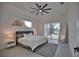 Spacious bedroom with sliding glass doors leading to a patio at 230 W Pine Valley Ln, Rotonda West, FL 33947