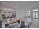 Open concept living area with modern kitchen and ample natural light at 230 W Pine Valley Ln, Rotonda West, FL 33947
