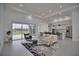 Open living room and kitchen with contemporary furnishings at 230 W Pine Valley Ln, Rotonda West, FL 33947