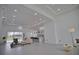 Open concept living space with modern kitchen and access to backyard pool at 230 W Pine Valley Ln, Rotonda West, FL 33947