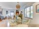 Small dining area with glass table and wicker chairs at 2574 Hawthorne St, Sarasota, FL 34239